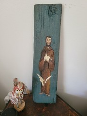 Painted on drift wood of monk and doves